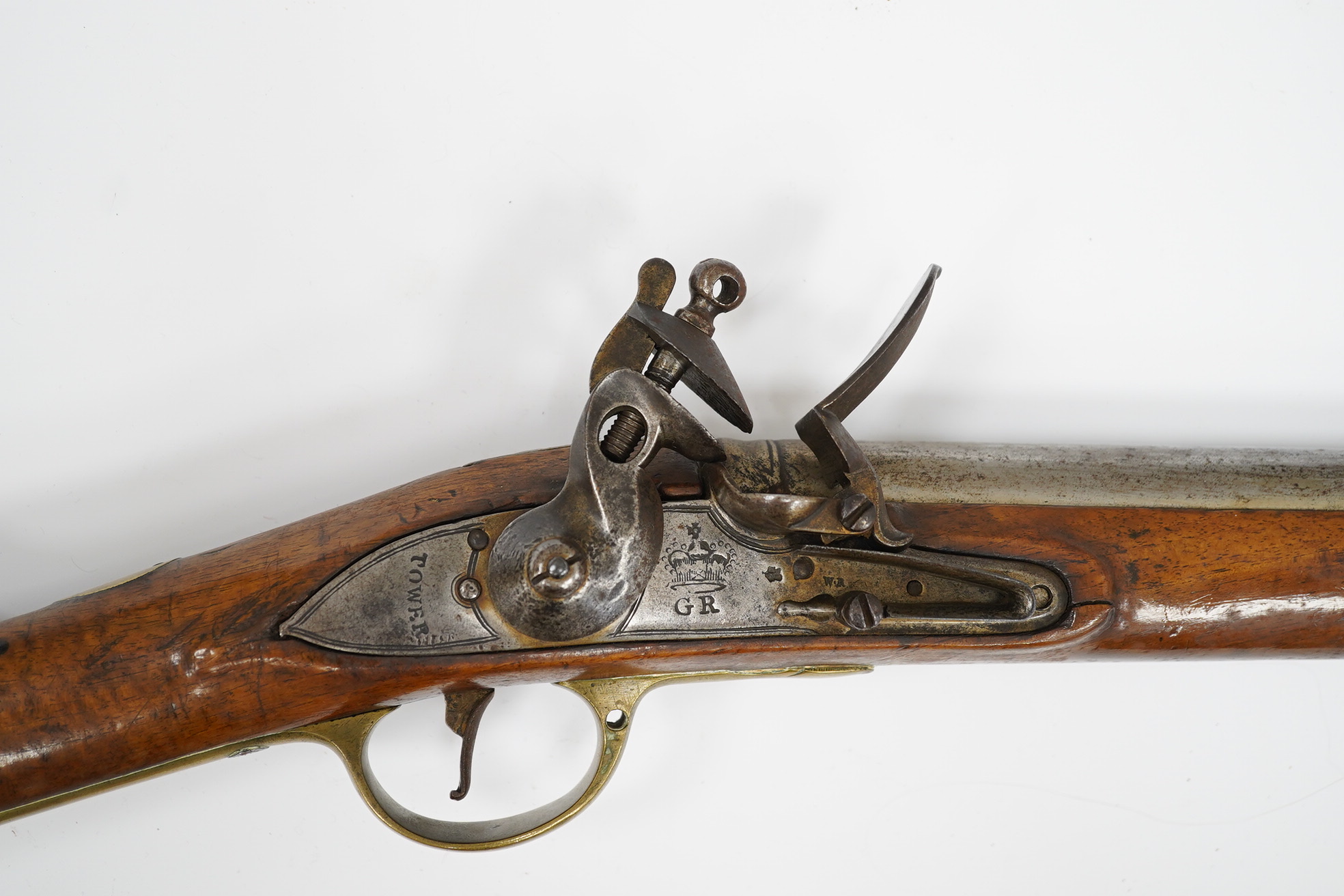 A ten bore flintlock musket of Brown Bess type, barrel 88cm, lock struck with crowned GR and Tower, regulation brass mounts. Condition - fair